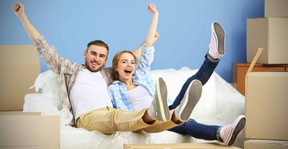 Happy young couple moving in their new home