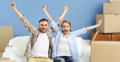 Happy young couple moving in their new house