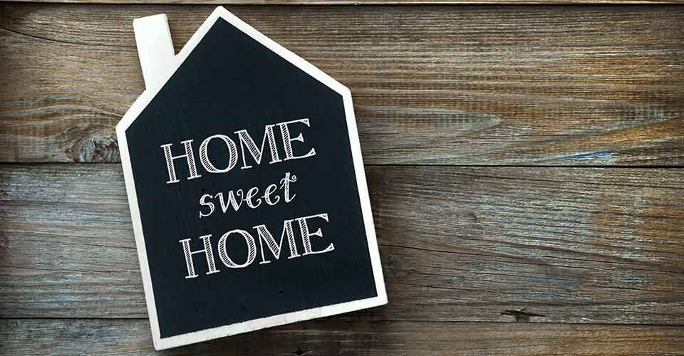 Home Sweet Home written on House shaped chalkboard