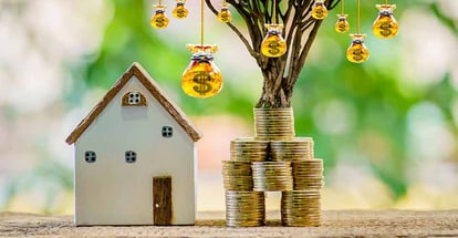 Home model and goal coins stack for real estate investment