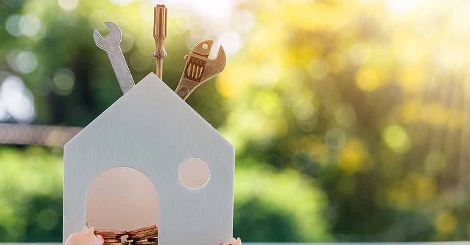 Home models gold coins and construction equipment to renovate home