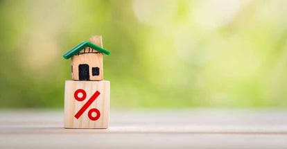 House is placed on a wooden block with percent symbol