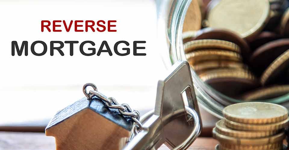 House key next to jar of coins for reverse mortgage
