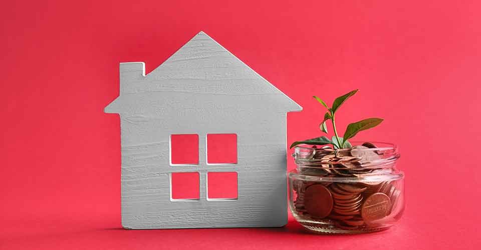 House model and jar with coins