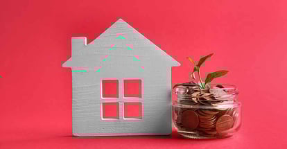 House model and jar with coins