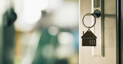 House model and key in house door