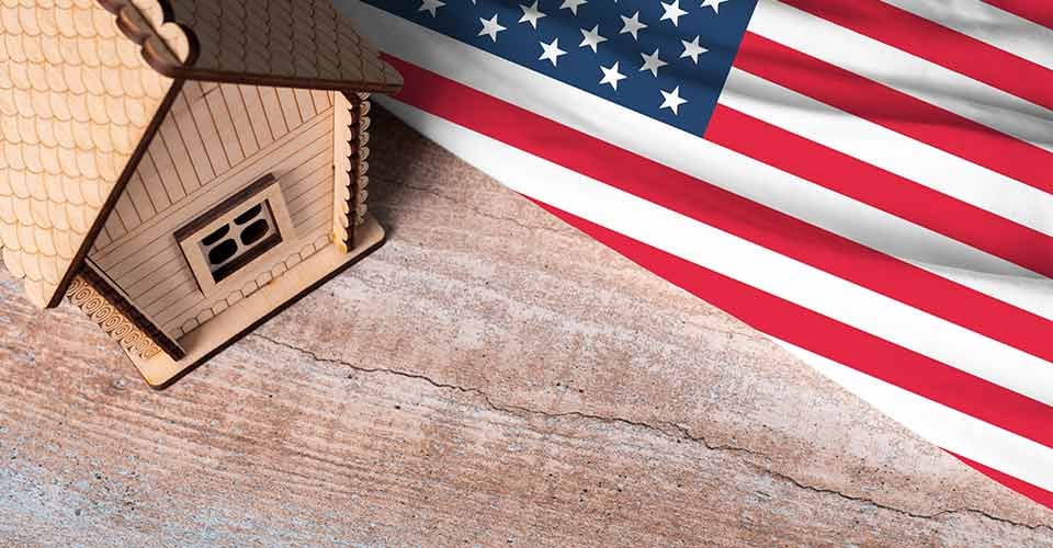 House model near USA flag