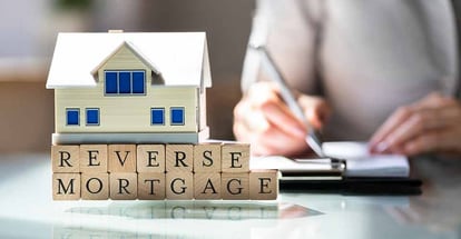 House model over reverse mortgage blocks