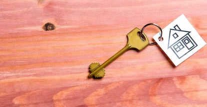 House symbol along with golden key