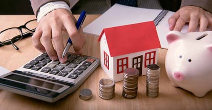 Investor calculating income from rental property