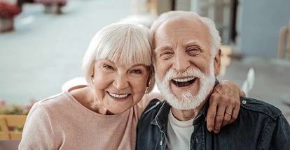 Joyful nice elderly couple smiling while being in a great mood