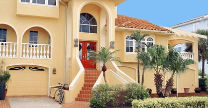 Large elegant three story home in Tropical Florida with lush tropical landscape