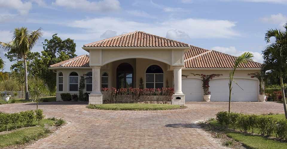 Mediterranean Style Home showing driveway and main entrance in Florida