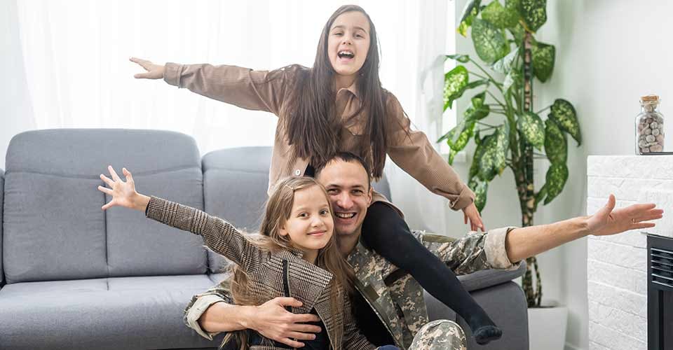 Military father and two daughters at new home