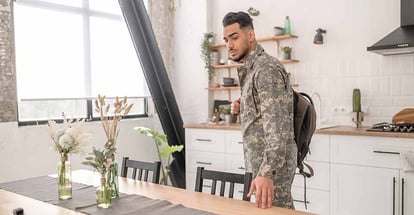 Military man looking around his new home