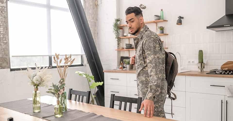 Military man looking around his new home