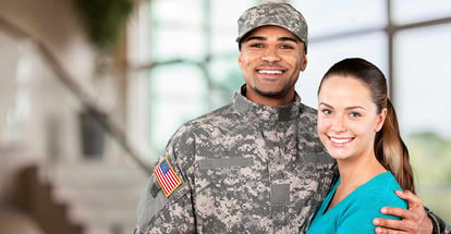 Military man with his wife in their new home