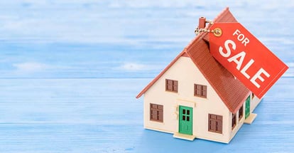 Model home with a tag for sale