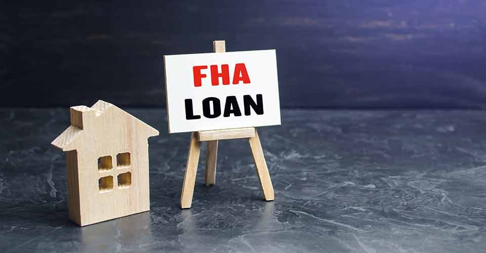 Model house and FHA loan easel sign