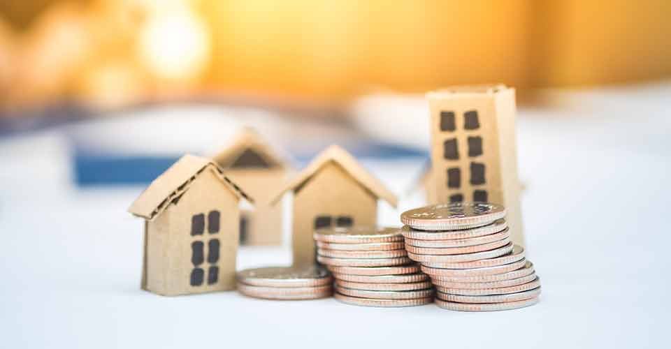 Model house and coins stack for down payment