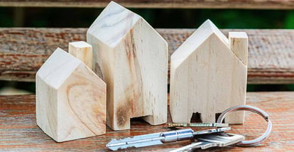 Model wooden houses and keys