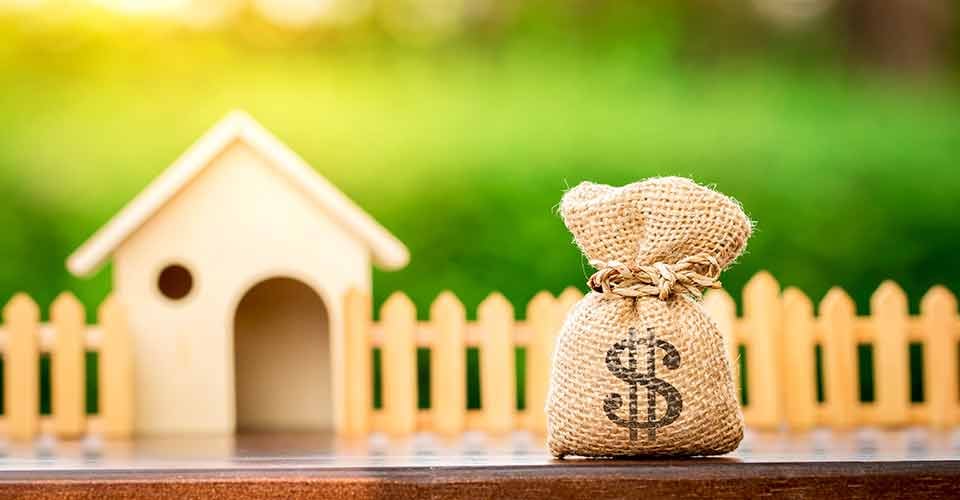 Money bag and model home for home renovation