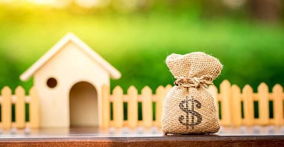 Money bag and model home for home renovation