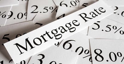Mortgage rates text and percent on a paper