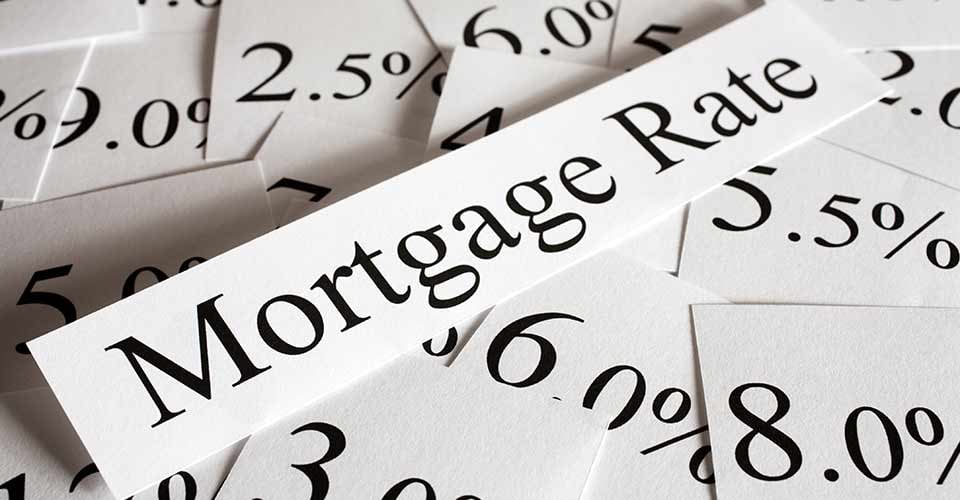Mortgage rates text and percent on a paper