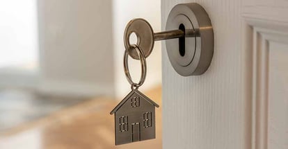 New home door with key and home shaped keychain