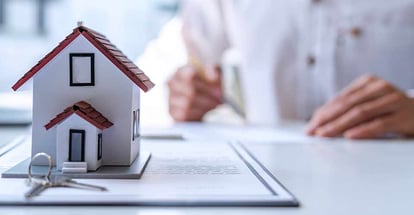 New homebuyer signing a contract to buy home