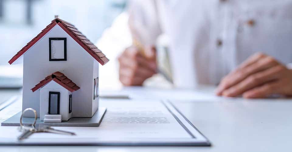 New homebuyer signing a contract to buy home
