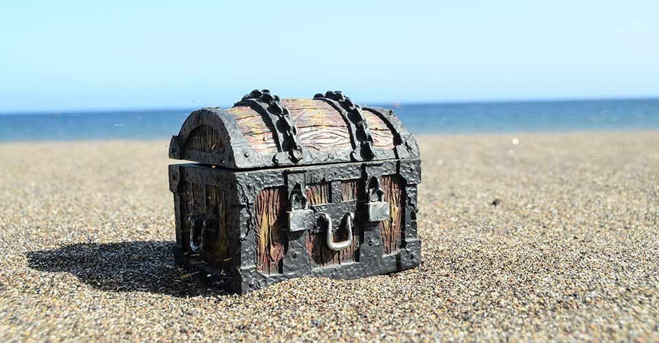 Old Classic Wood and Iron Treasure Chest on the Beach
