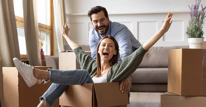 Overjoyed young couple in new house