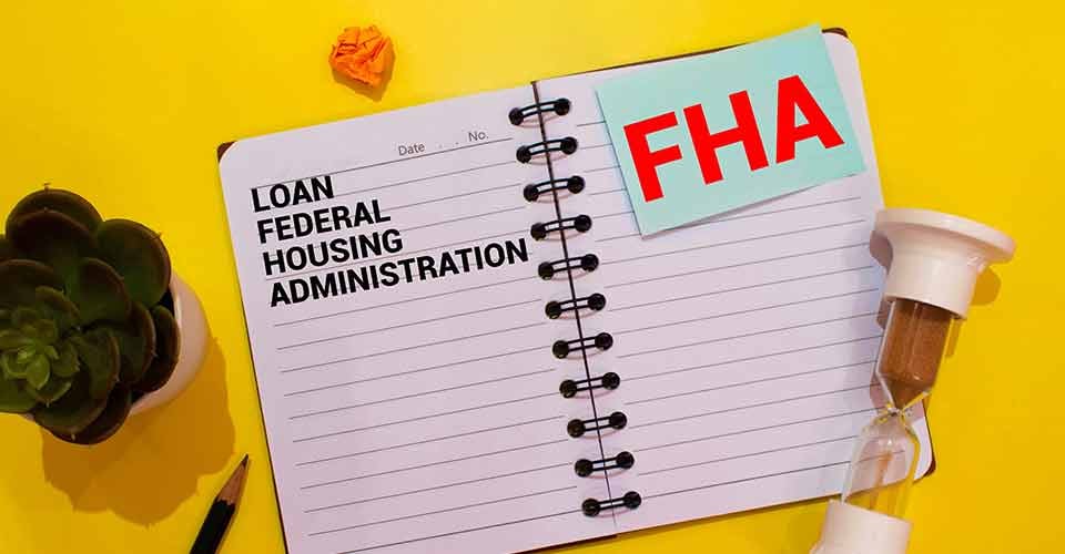 Paper with FHA loan on a table