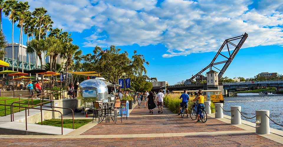 People biking and walking at Riverwalk in Tampa Bay Florida
