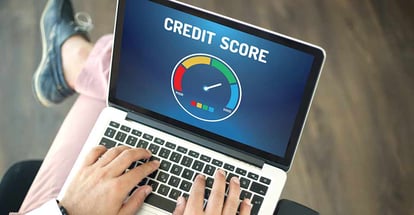 People using laptop to check credit score