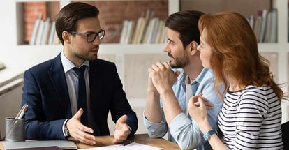 Professional financial advisor consulting happy couple