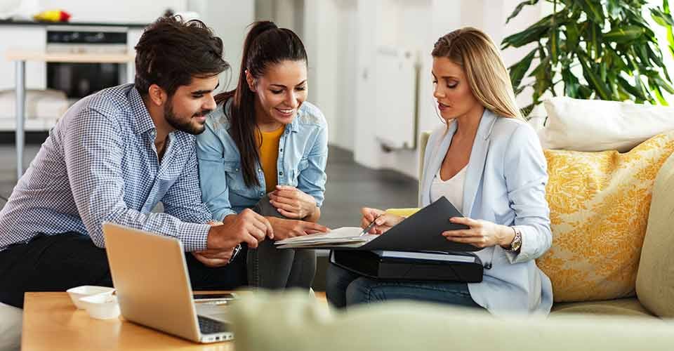 Real Estate agent offer home ownership to young couple