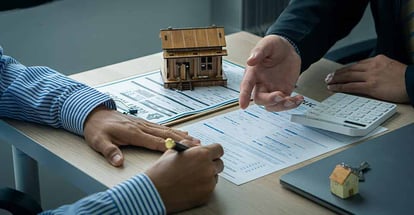 Real estate agent and buyer discussing home purchases