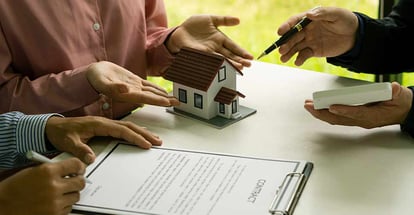 Real estate agent and client discussing home purchases