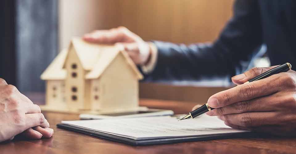Real estate agent explaining about home purchase agreement