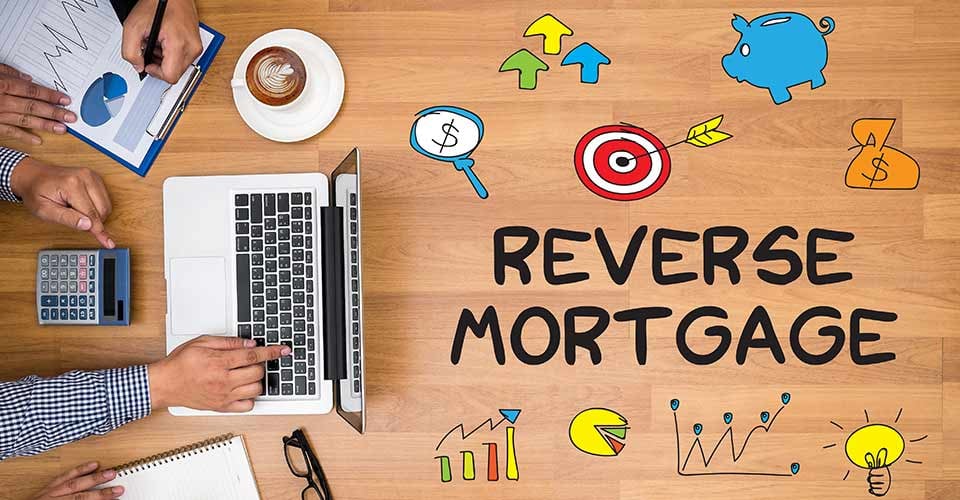 Reverse Mortgage Business team hands at work with financial reports and a laptop