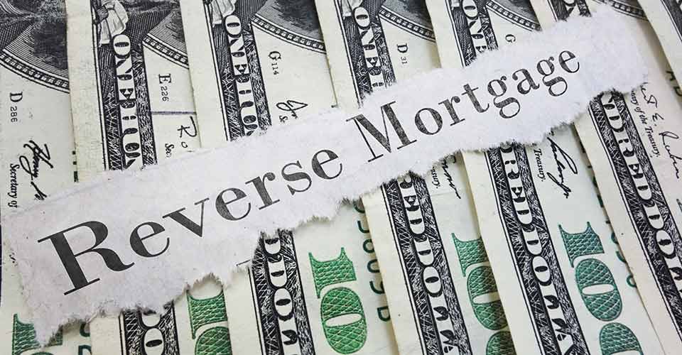 Reverse Mortgage paper message on assorted cash