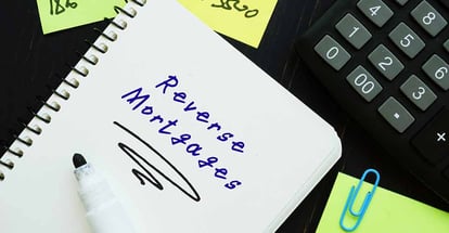 Reverse Mortgages phrase on the paper sheet
