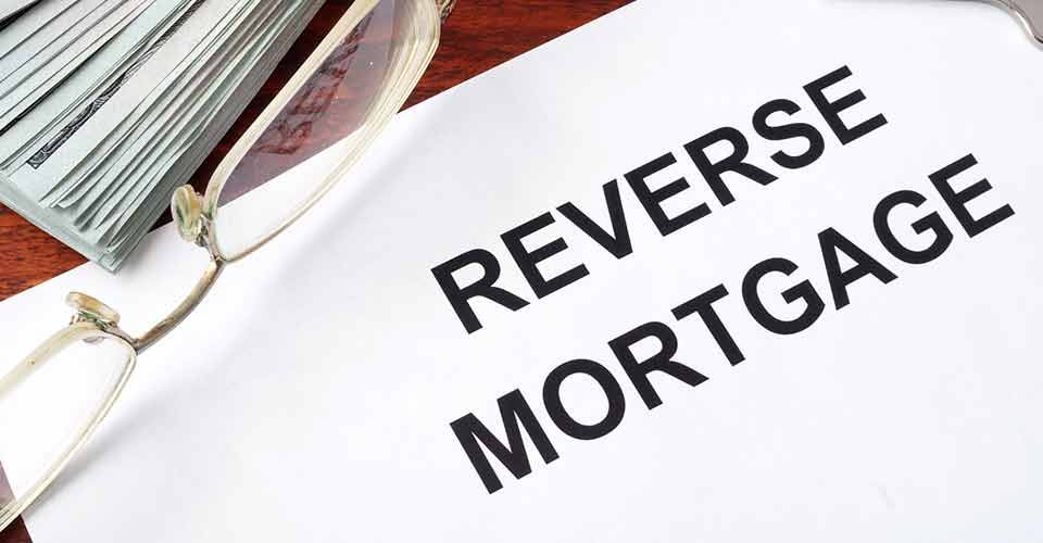 Reverse mortgage form on a table and money