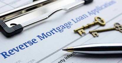 Reverse mortgage loan application and ballpoint pen on a table