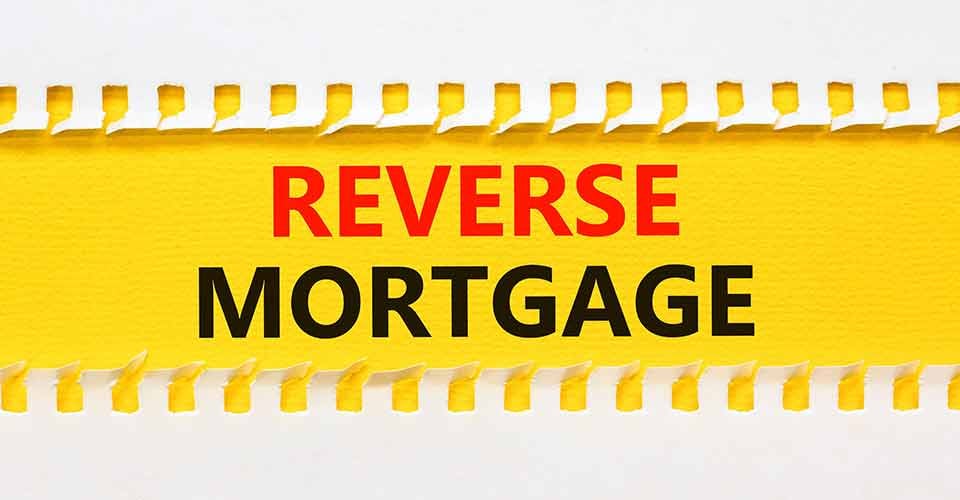Reverse mortgage words on yellow paper
