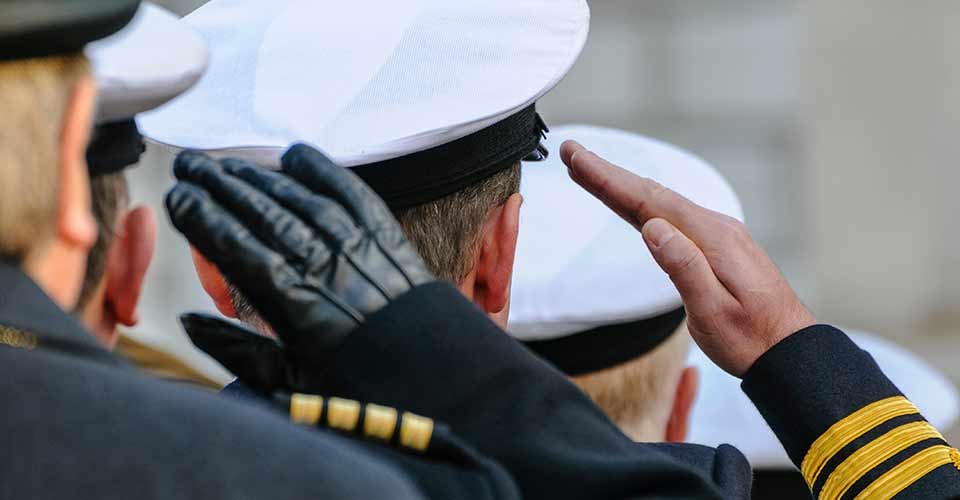 Royal Navy officers salute