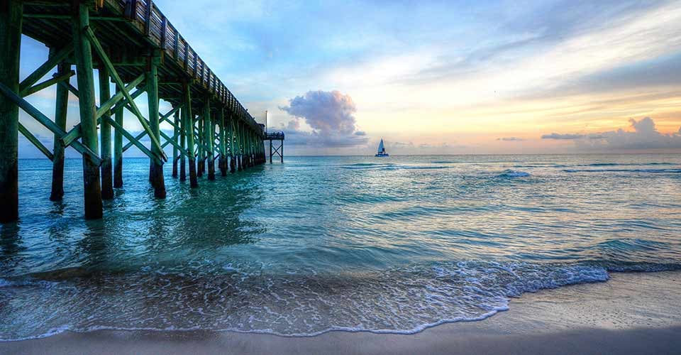 Sailboat and pier at St Andrews St Park Panama City Beach Florida